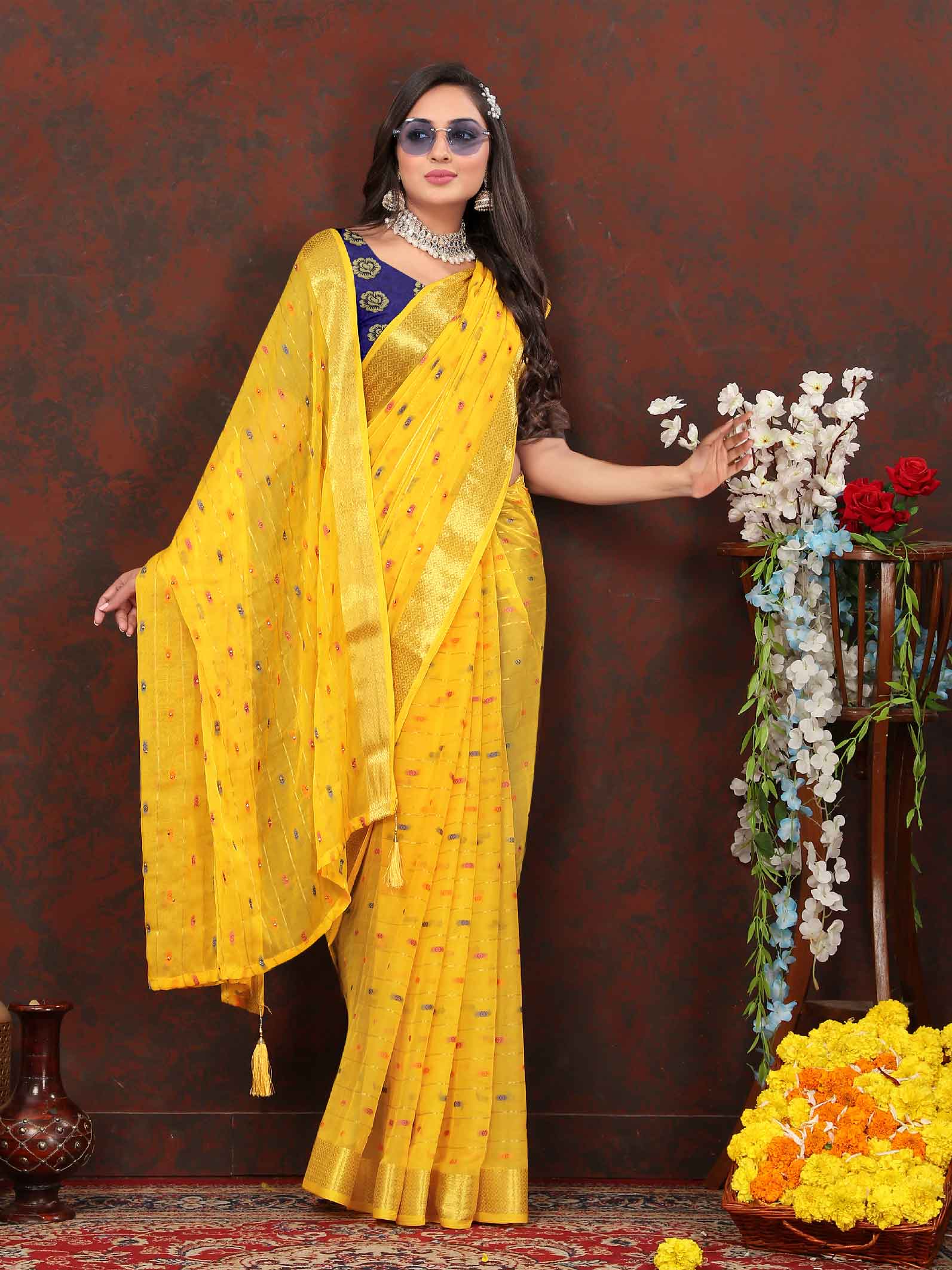 Glamorous Women's Party Wear Yellow Chiffon Saree with Woven Stripe Zari Border and Tassels - Elevate your look with this stunning ensemble! Perfect for special occasions, this saree boasts intricate zari detailing and playful tassels for a touch of elegance. Stand out and make a statement in this luxurious saree. Don't miss the chance to add this timeless piece to your wardrobe and shine bright at any event