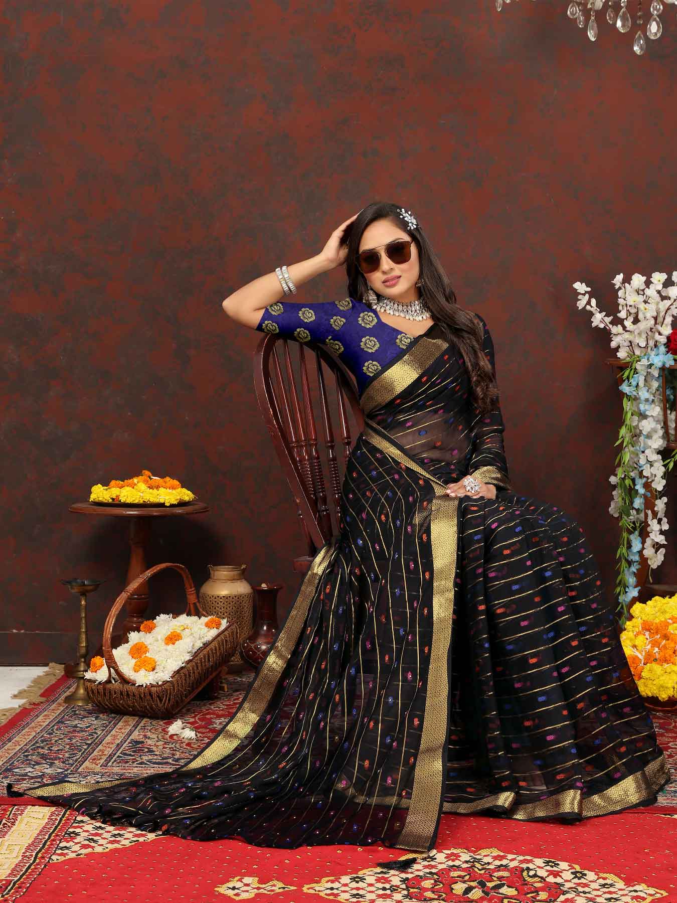 Elegant Women's Party Wear Black Chiffon Saree with Woven Stripe Zari Border and Tassels - Make a statement with this stunning ensemble! Perfect for special occasions, this saree features intricate zari detailing and playful tassels for a touch of glamour. Elevate your style and stand out from the crowd in this luxurious saree. Don't miss out on adding this timeless piece to your wardrobe!