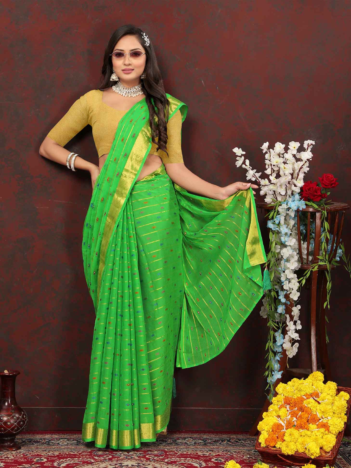 Chic Women's Party Wear Green Chiffon Saree with Woven Stripe Zari Border and Tassels - Elevate your style with this stunning ensemble! Perfect for special occasions, this saree features intricate zari detailing and playful tassels for a touch of elegance. Stand out from the crowd and make a statement in this luxurious saree. Don't miss out on adding this timeless piece to your wardrobe