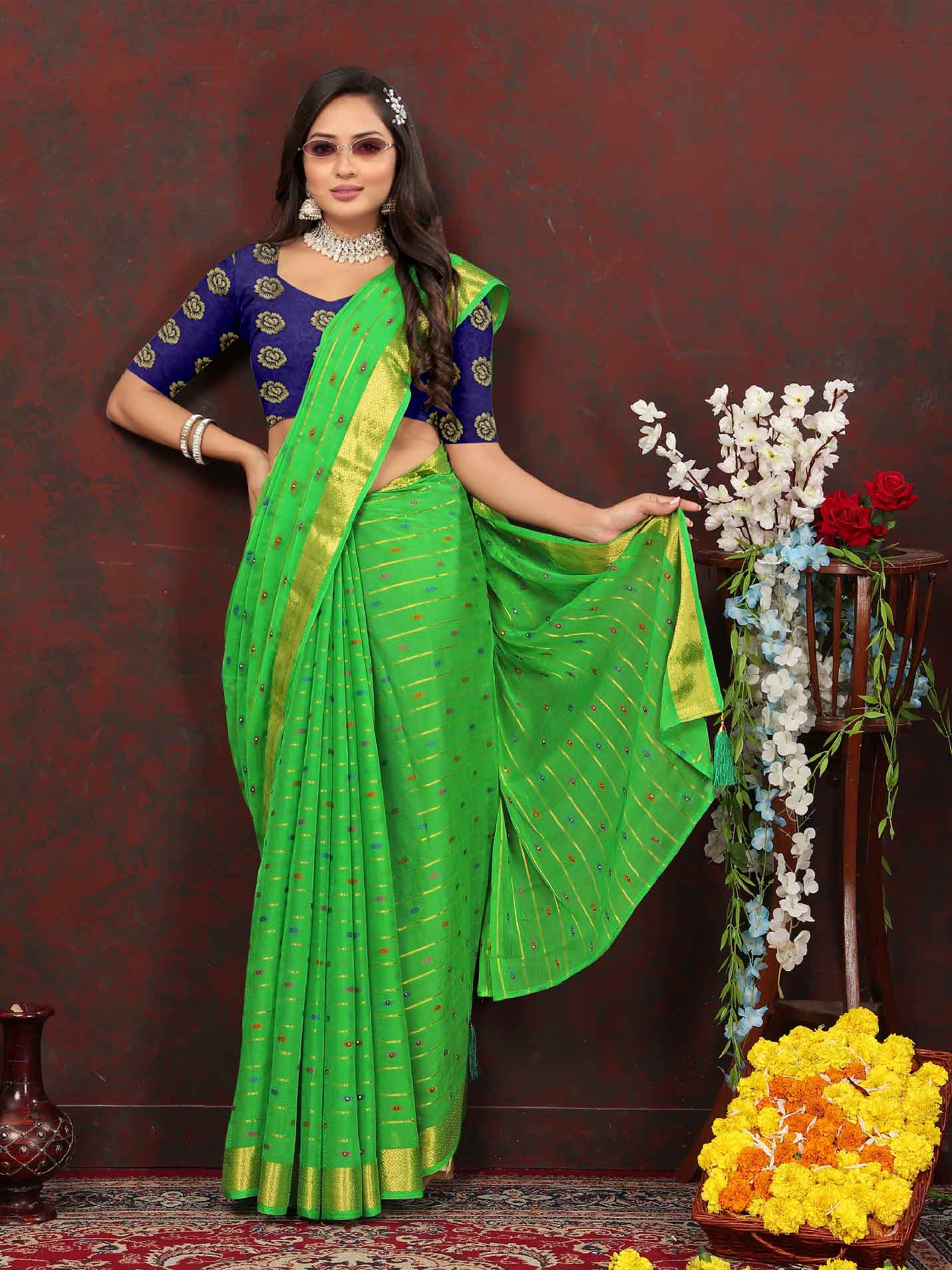 Chic Women's Party Wear Green Chiffon Saree with Woven Stripe Zari Border and Tassels - Elevate your style with this stunning ensemble! Perfect for special occasions, this saree features intricate zari detailing and playful tassels for a touch of elegance. Stand out from the crowd and make a statement in this luxurious saree. Don't miss out on adding this timeless piece to your wardrobe